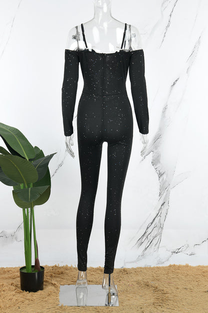 SOUTHWEST UNLIMITED glitter off-shoulder top with a shimmering fabric and elegant silhouette against a neutral background.