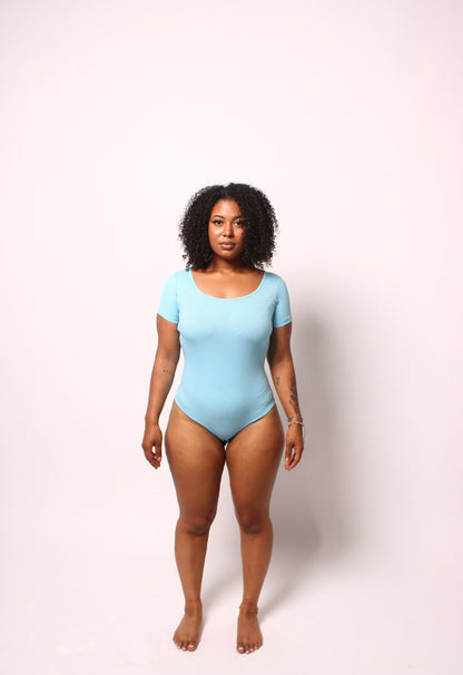 Black Icon Bodysuit by SOUTHWEST UNLIMITED featuring a sleek design and fitted silhouette.